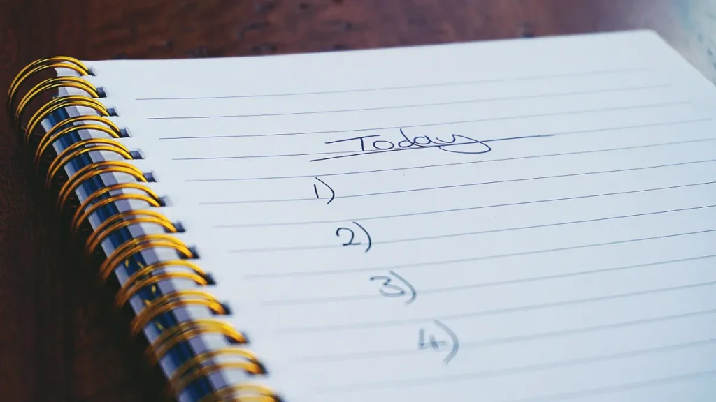 handwritten numbered outline in a spiral notebook