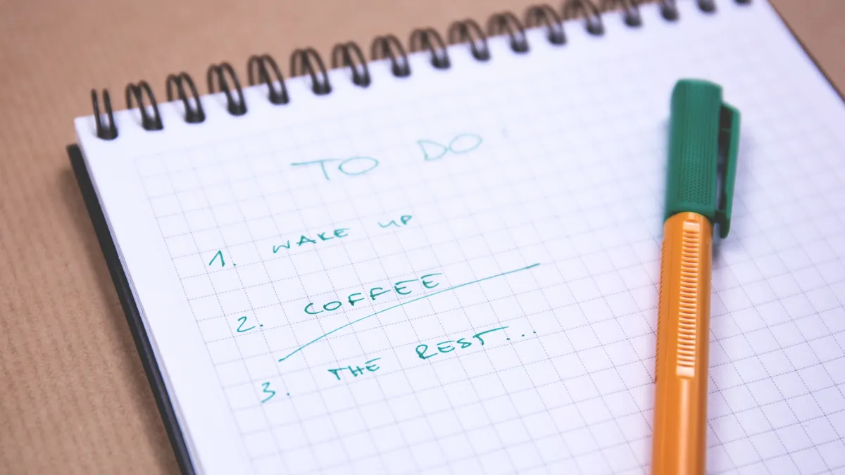 How to build a blog post outline with an AI auto writer to-do list in a notebook with a pen