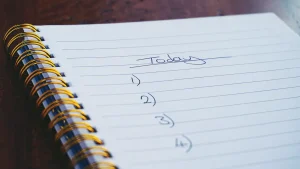 handwritten numbered outline in a spiral notebook